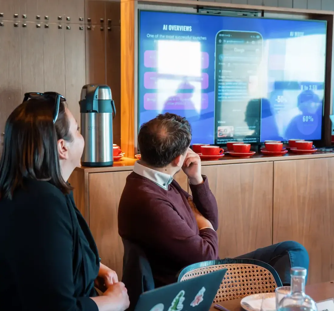 Attendees watching a session at a Sleeping Giant Media event